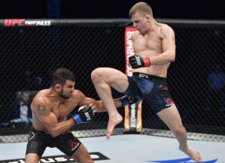 Grant Dawson (right) launches a flying knee at Nad Narimani, UFC Fight Island 2