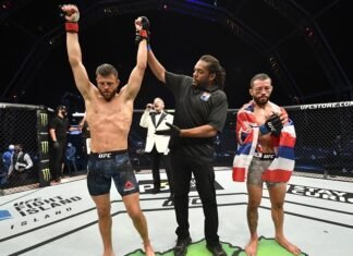 Calvin Kattar gets his hand raised following a hard-fought victory against Dan Ige at UFC Fight Island 1