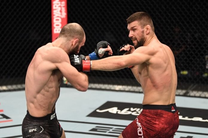 Mateusz Gamrot of Poland punches Guram Kutateladze, UFC