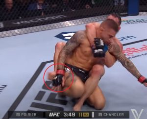 Poirier uses his right hand to block Chandler from inserting a second hook